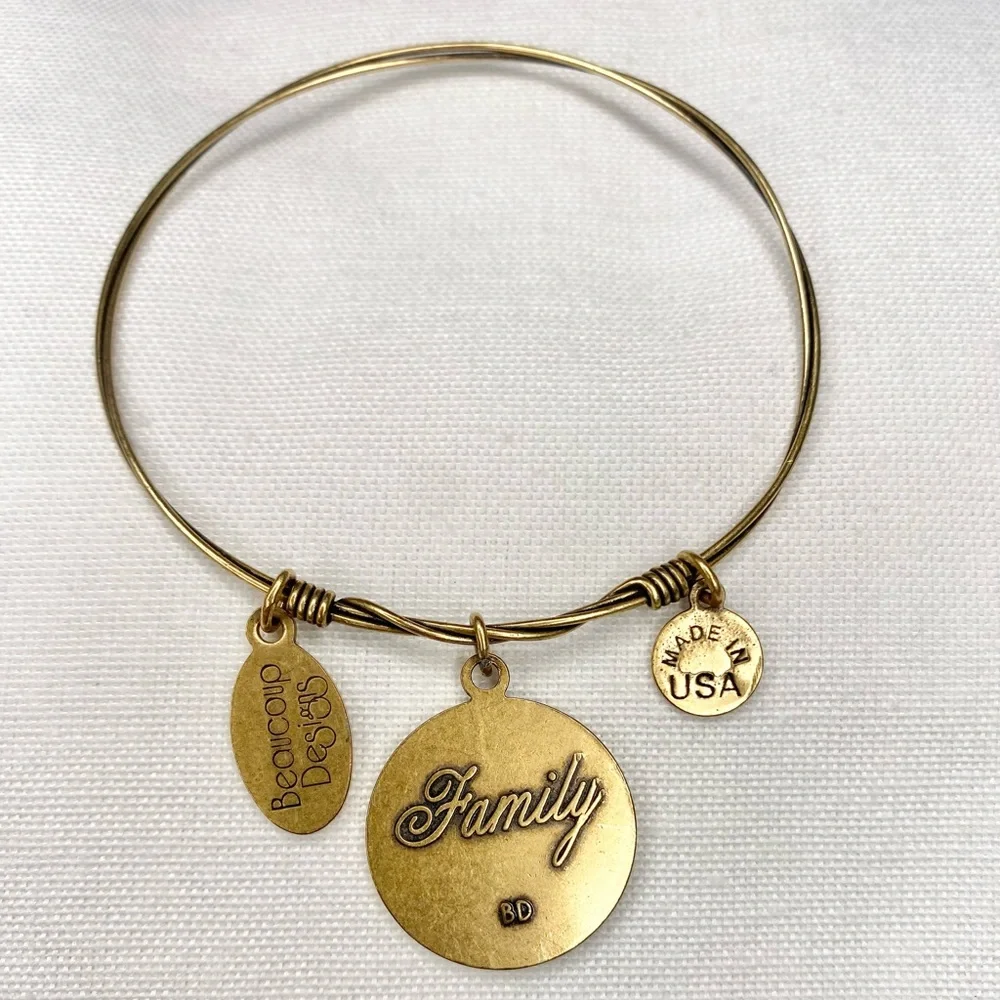 Gold tone bracelet family tree, “merci”, Eiffle tower charm